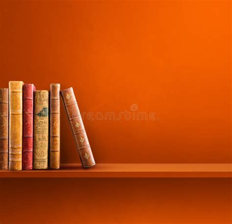 Row Of Old Books On Orange Shelf Square Background Stock Image Image