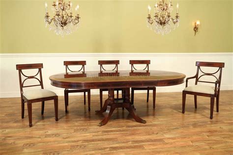 Traditional 54 Inch Round Mahogany Pedestal Table With Leaves