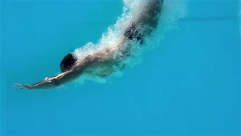 Fit Man Swimming Underwater In The Pool In Slow Motion Stock Footage