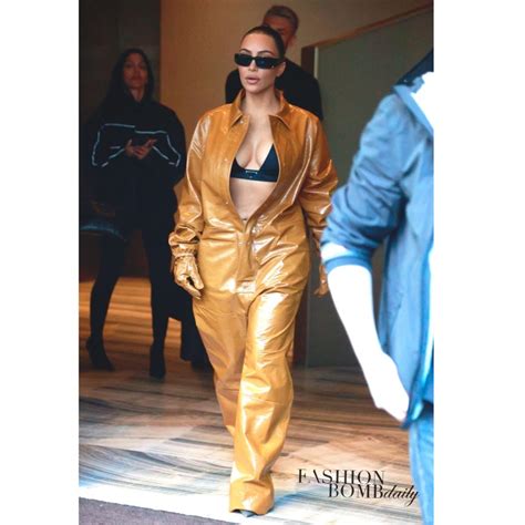 hot or hmm kim kardashian ‘s milan prada triangle top and yellow brown leather jumpsuit
