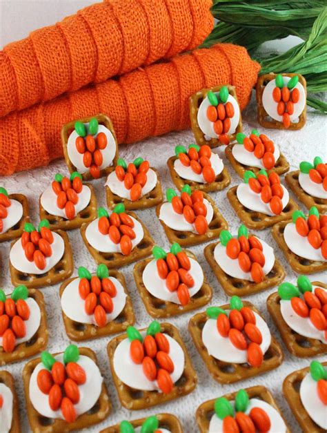 The shops are full of bright easter displays decorated with chicks, rabbits and flowers, all with the objective of selling chocolate eggs in huge numbers. Easter Bunny Carrot Pretzel Bites - Two Sisters