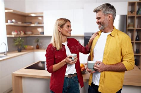 senior couple holding coffee happy mature spouses drinking morning coffee stock image image