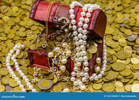 Vintage Treasure Chest Full Of Gold Coins And Jewelry On A Background