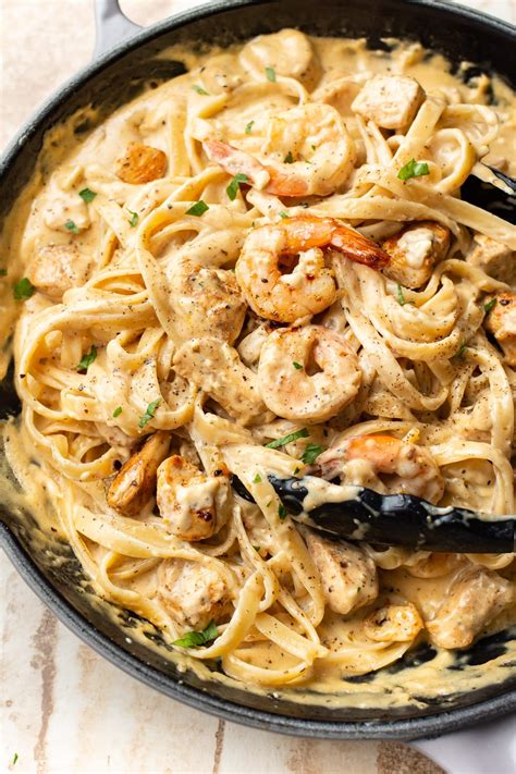 Creamy tomato chicken and shrimp pasta recipe | dinewithmuni. There's chicken and shrimp in this creamy, cheesy Alfredo ...