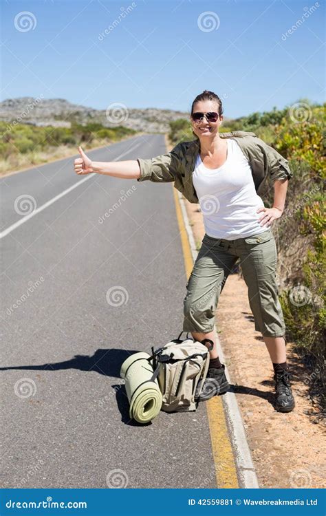 Pretty Hitchhiker Sticking Thumb Out On The Road Stock Image Image Of