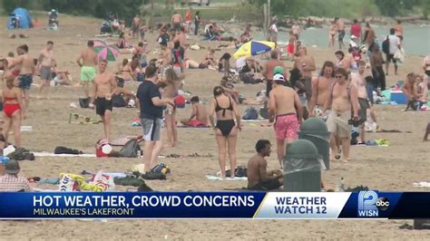 People Flock To Beach During Heat