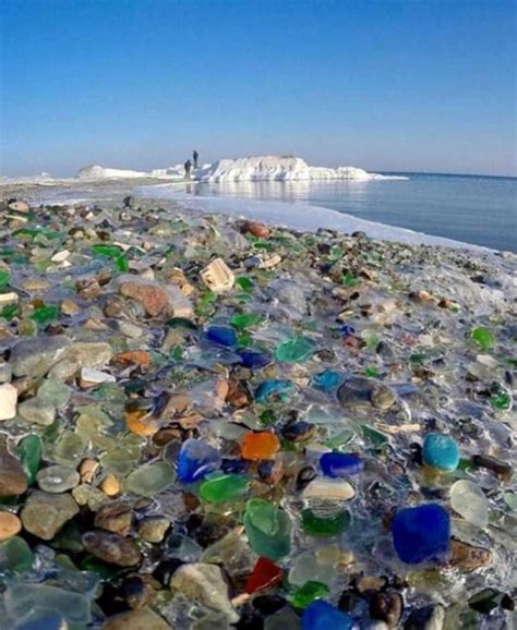dumped glass on ussuri bay in russia has been shaped into colourful pebbles sea glass beach sea