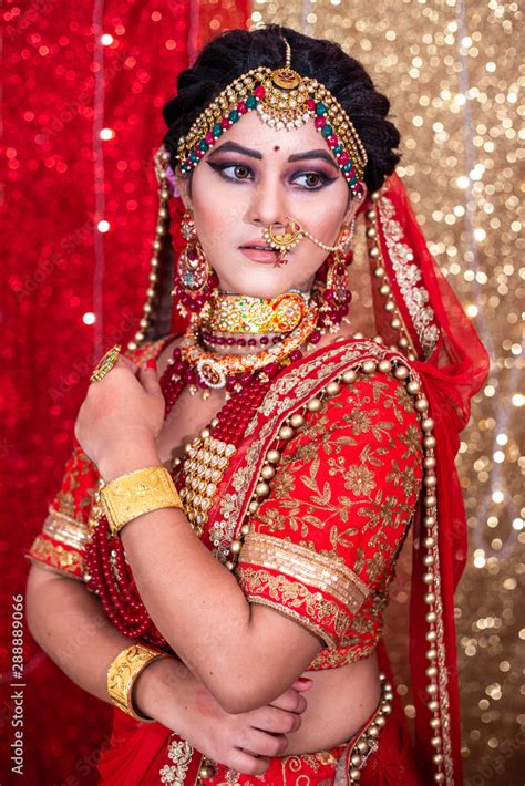 Beautiful Indian Girl In Bride Look Wearing Red Lehanga And Gold
