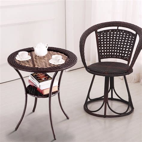 A coffee table is a central piece in any living space. Round Rattan Wicker Glass Top Steel Frame Coffee Table