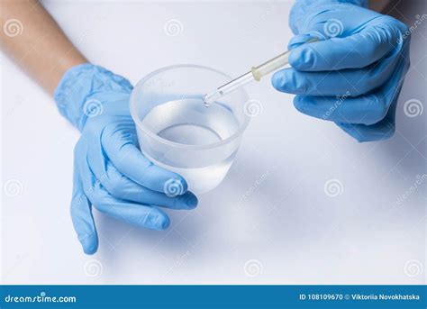 A Nurse Dripping Adds The Medicine From The Pipette Royalty Free Stock
