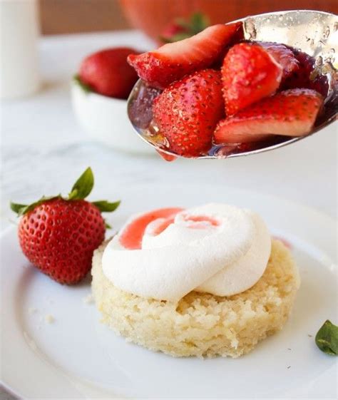 Strawberries And Cream On A Plate With A Spoon