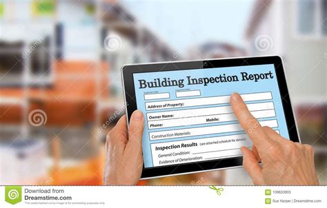 Buiding Inspector Completing An Inspection Form On Computer Tablet