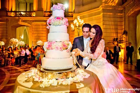 If you're anticipating some wedding cake in your face, hit me with your best. Wedding Traditions Explained - Cake Cutting Tradition