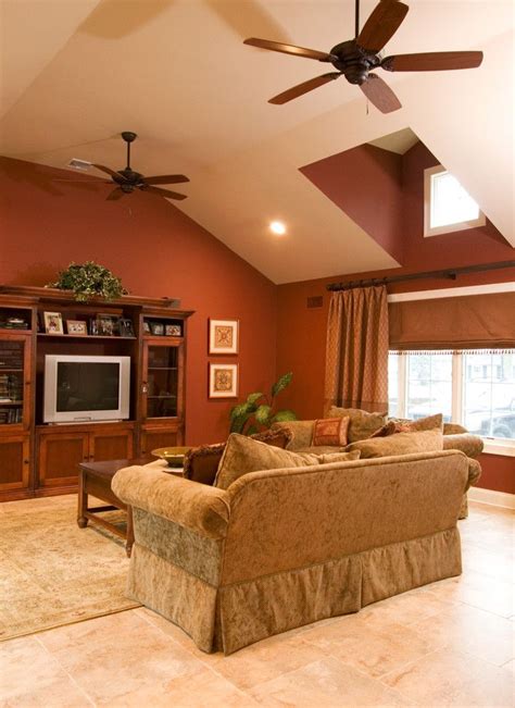 There's something just so cozy and inviting about a home decorated with warm shades of brown. burnt orange and gray accent walls with fireplace - Google ...