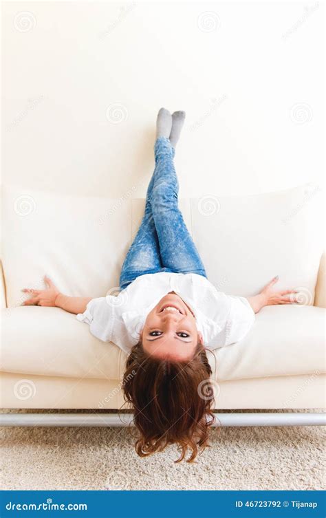 Woman Lying Upside Down On A Sofa Stock Photo Image Of Upside Joyful