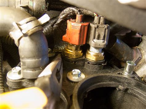 How To Replace the Upper and Lower Thermostat Housing on a ...