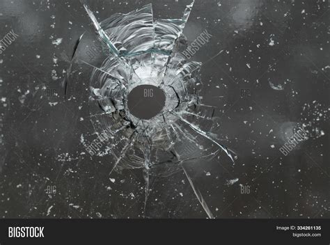 Bullet Hole Through Glass