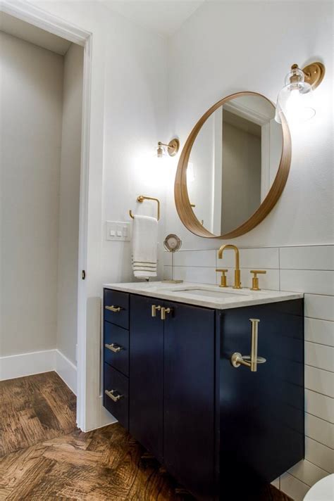 Covering magnetic cabinet latch safely. Love this modern bathroom with #gold touches. That toilet ...