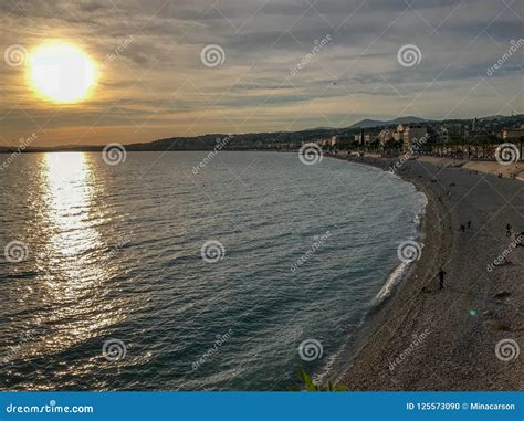 Sunset Over The Mediterranean The Beach At Nice France Stock Photo
