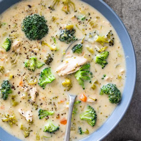 A Bowl Of Soup With Broccoli And Chicken