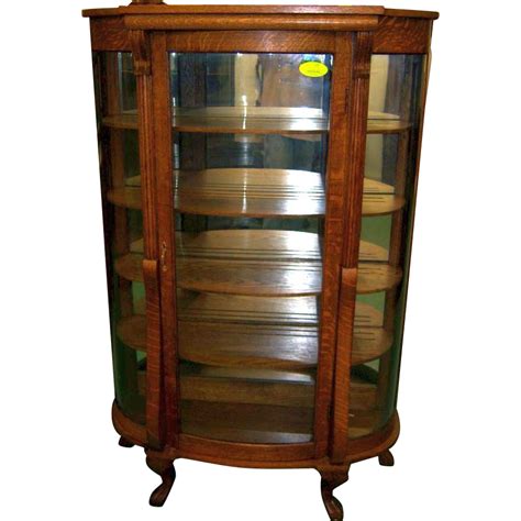 Beaming with handcrafted pride, this curio. Oak Curved Glass China or Curio Cabinet from ...