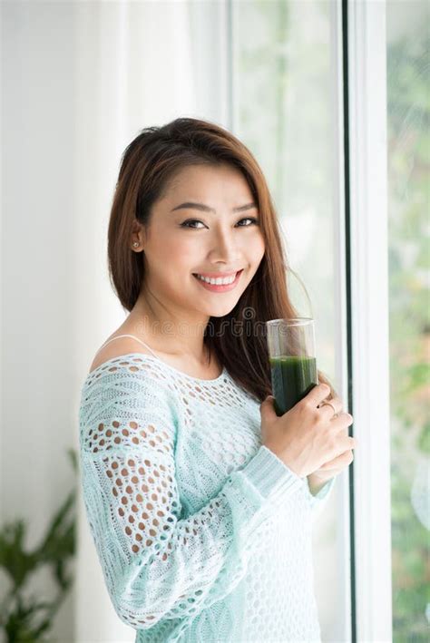 Smiling Young Asian Woman Drinking Green Fresh Vegetable Juice O Stock Image Image Of