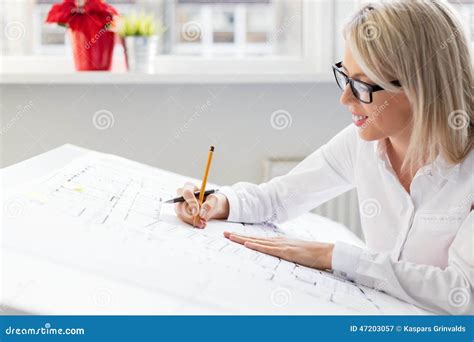 Woman Architect Working On Architectural Blueprints Stock Image Image