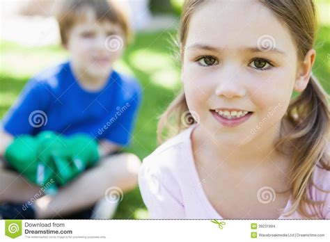Two Smiling Kids At The Park Stock Photo Image Of Sibling Focus
