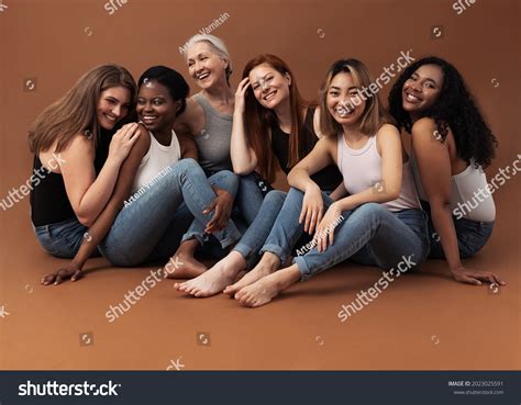 Six Women Different Ages Sitting Together Stock Photo