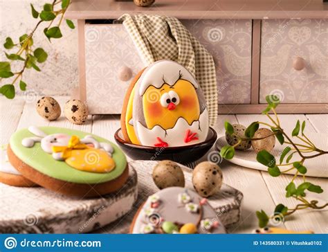 Cookies With Painted Easter Bunny And Chicken Near Decorative Buffet