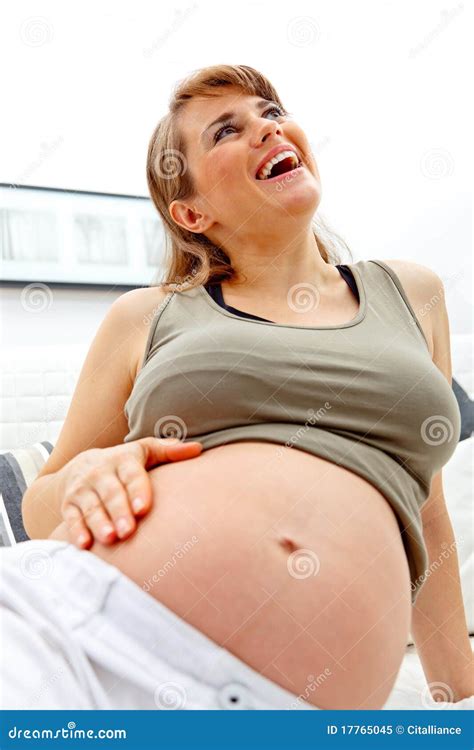 Laughing Beautiful Pregnant Woman Relaxing On Sofa Stock Image Image