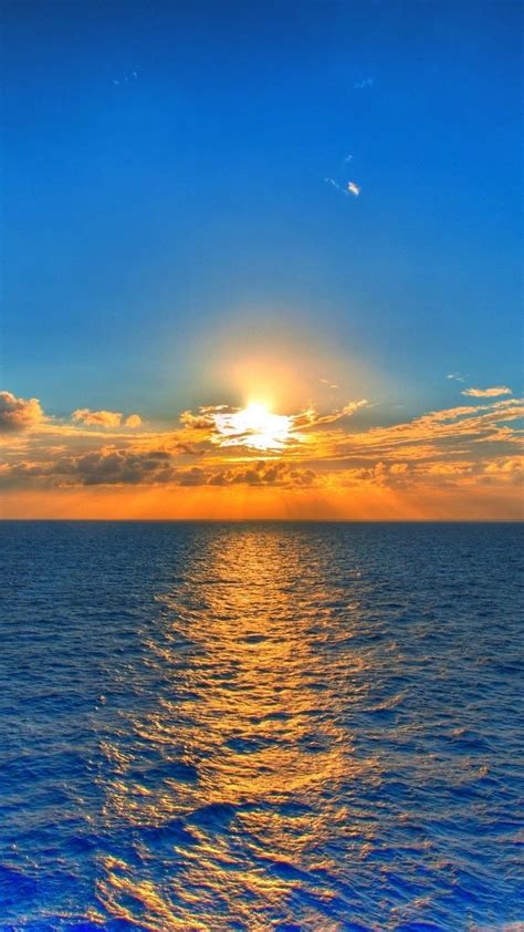 Download Wallpaper 938x1668 Sky Sun Sea Path Reflection Clouds
