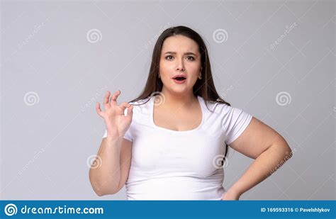 Shocked Plus Size Model With Wide Open Mouth On Purple Background Royalty Free Stock Image