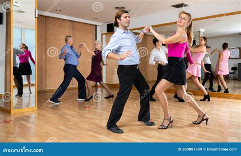 Cheerful Man And Woman Practicing Ballroom Dances In Ballroom Stock Image Image Of Female