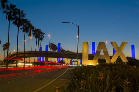 Iconic Lax Los Angeles International Airport Sign At Night Points