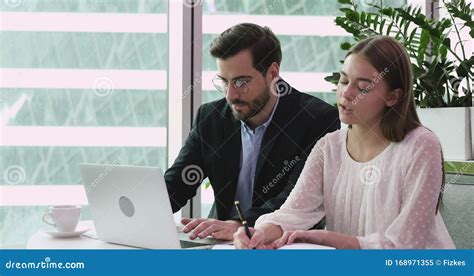 Male Mentor Helping Female Intern With Corporate Software In Office Stock Video Video Of Boss