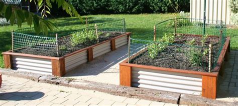 Corrugated Metal Painted White And Wood Framing Raised Garden Bed
