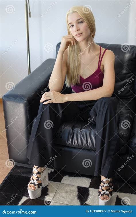 Blonde Woman Sitting In An Armchair Stock Image Image Of Girl House