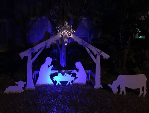 Diy Outdoor Nativity Christmas Display With A Blue Spot Light And Gold