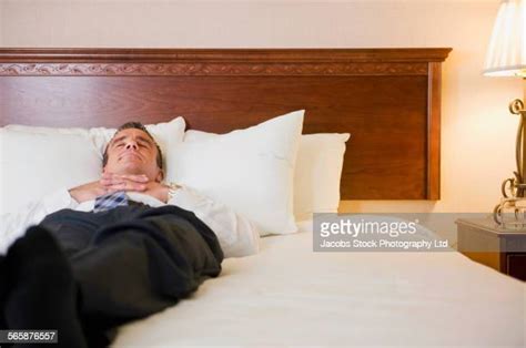 Man Sleeping In Hotel Bed Photos And Premium High Res Pictures Getty