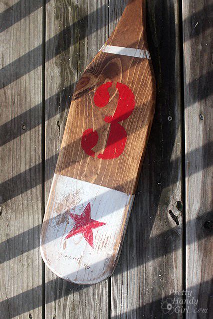 Visible brackets hold an oar like a curtain rod. Creating Vintage Painted Oars with 3M | Painted oars, Oar ...