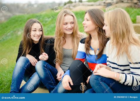 Four Happy Teen Girls Friends Having Fun Outdoors Stock Photo Image