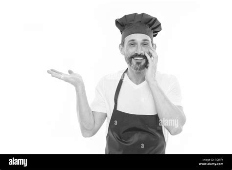 Presenting Product Bearded Mature Man In Chef Hat And Apron Pointing Hand Aside Senior Cook