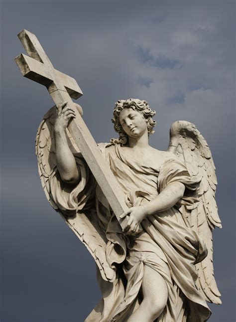 A Statue Of An Angel Carrying Christs Cross Is Seen On The Castel Sant
