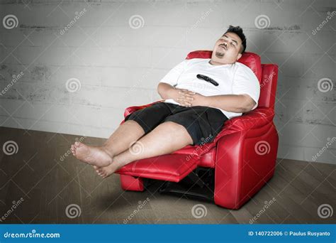 Young Fat Man Falling Asleep On The Sofa Stock Photo Image Of Asleep