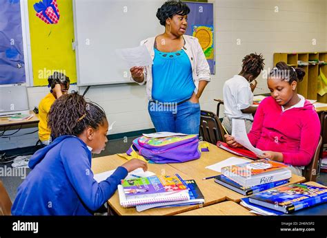 An Elementary School Teacher Goes Over A Lesson Plan With Her Students