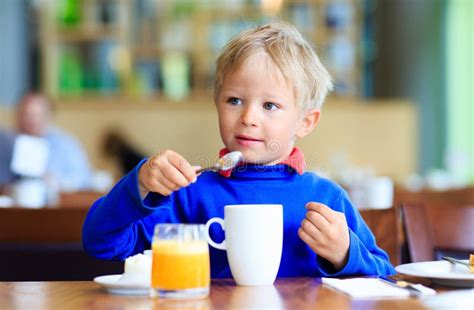 Little Boy Eating Breakfast In Cafe Stock Image Image Of Little