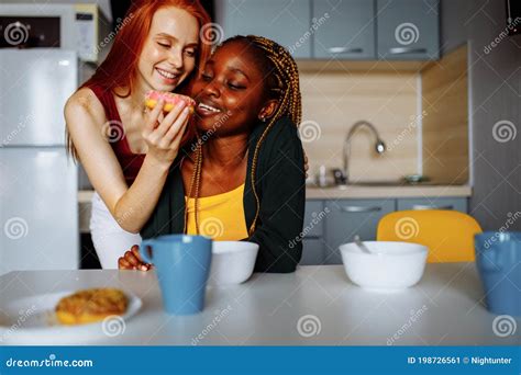 Happy Lesbian Couple Preparing Breakfast In The Kitchen Stock Image Image Of Affection