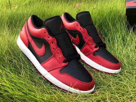 Black covers the toe box, side panels, branded tongues and insoles. 2020 Men's Air Jordan 1 Low "Reverse Bred" Varsity Red ...