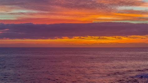 Download Wallpaper 1366x768 Sunset Sea Horizon Clouds Waves Tablet